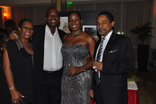 Janet Silvera Photo 
 
From L- Diversey Johnson's Metty Scarlett-Jones and husband Dr. Carl Jones in a couples match up with Digicel's Joy Clark and her husband, attorney-at-law Maxim Clark at the Rose Hall Ball last Saturday night at the Hilton Rose Hall Resort and Spa in Montego Bay.