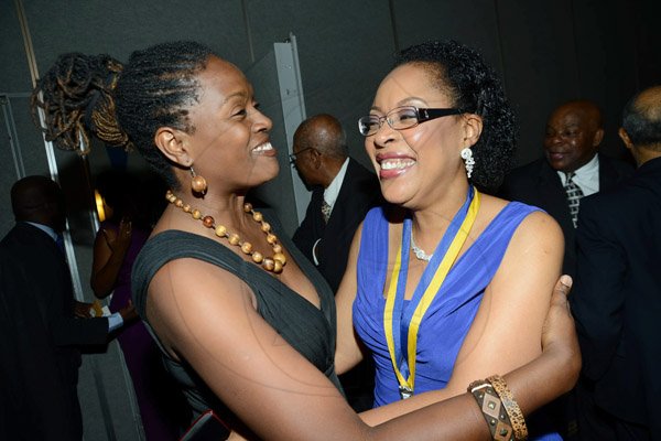 Rudolph Brown/ Photographer
Chorvelle Johnson, (left) Chief Executive Officer of Proven greets Outgoing President  of the Rotary Club of St Andrew Judy Hylton at the Club Installation banquet at the Jamaica Pegasus Hotel in New Kingston on Tuesday, July 9, 2013.
