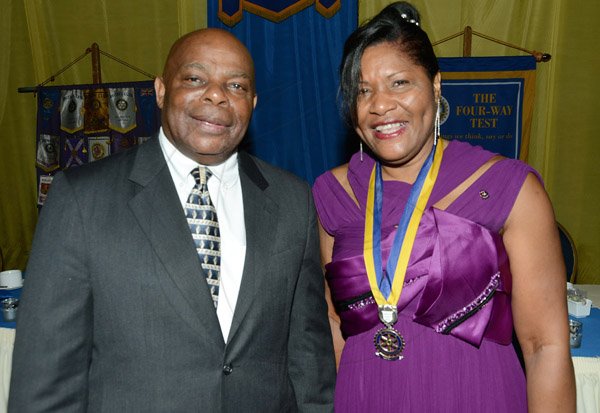 Rudolph Brown/ Photographer
New president Marie Powell, pose with her husband after she was installed president of the Rotary Club of St. Andrew at the club Installation banquet at the Jamaica Pegasus Hotel in New Kingston on Tuesday, July 9, 2013.