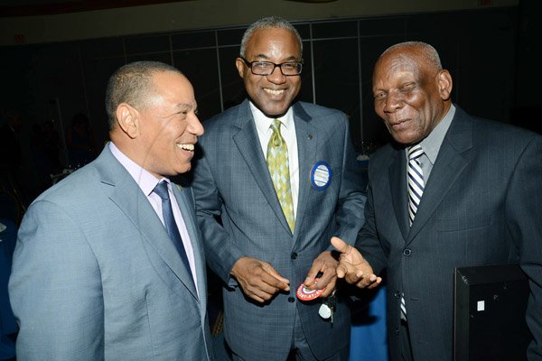 Rudolph Brown/ Photographer
Eugene Ffolkes, (left) chat with Rev Webster Edwards, (right) and Robert Drummond at the Rotary Club of St. Andrew Installation banquet at the Jamaica Pegasus Hotel in New Kingston on Tuesday, July 9, 2013.
