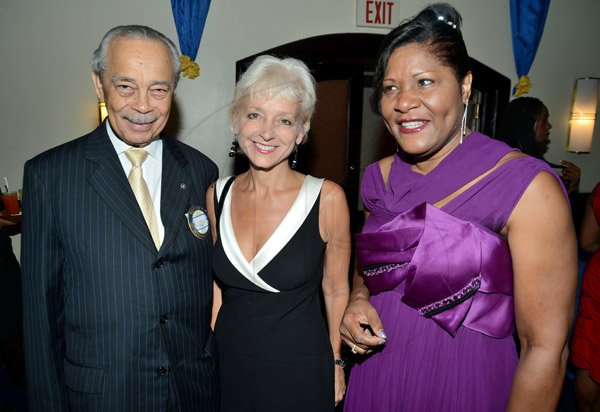 Rudolph Brown/ Photographer
Alvaro Casserly, pose with new President of Rotary Club of St. Andrew Marie Powell, (right) and Kelly Tombin, JPS president and CEO  at the club Installation banquet at the Jamaica Pegasus Hotel in New Kingston on Tuesday, July 9, 2013.