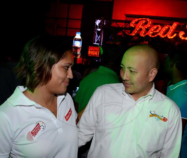 Winston Sill/Freelance Photographer
Launch of Red Stripe Premier League(RSPL) Football, held at Red Stripe Complex, Spanish Town Road on Wednesday night September 3, 2014. Here are Erin Mitchell (left), Brand Manager, Red Stripe; and Matthew Lyn (right), Director, CB Chicken.