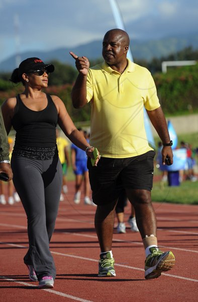 Ricardo Makyn/Staff Photographer
Right veteran Sports Journalist Hubert Lawrence and a female seems to be giving his companion some History lesson on the Stadium East track  at the Heart Fund run titled Run for your Heart at the Stadium  East Track on Sunday 25.11.2012