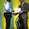 Ricardo Makyn/Staff Photographer
Richard Byles Presdent and Ceo  Sagicor presents   Gianluca Webster who will be attending Ardenne High School at the Sagicor annual GSAT awards ceremony at the Knutsford Court Hotel on Thursday 23.8.2012