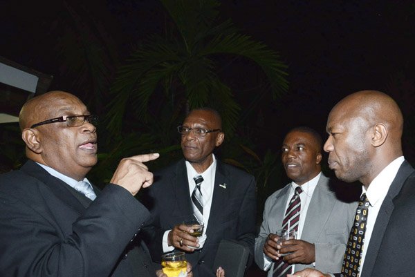 Winston Sill/Freelance Photographer
BUSINESS DESK:----- Sagicor Group Jamaica Annual Corporate Staff Awards Ceremony, held at the Jamaica Pegasus Hotel, New Kingston on Wednesday night march 12, 2014. Here are Desmon Jamgalee (left); Delroy Bryan (second left); Neuton Nelson (second right); and Hugh Meredith (right).