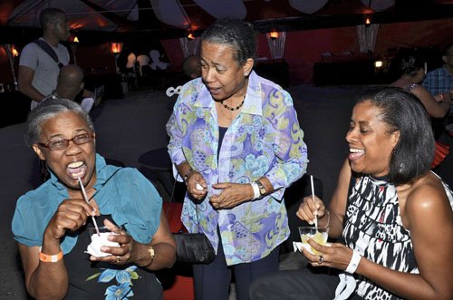 Rudolph Brown/Photographer
Something hilarious brews among (from left) Jacinth Kelly, Gloria Harris, and Kimberlyn Baltick at the Sagicor Christmas party.




 at the office car park in New Kingston on Saturday, December 3-2011