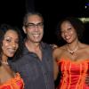 Rudolph Brown/Photographer
Richard Byles, president and chief executive officer of Sagicor Life Jamaica, pose with from left Shanique Clarke, Kay-Ann White and Gayanna Campbell at the Sagicor Christmas party at the office car park in New Kingston on Saturday, December 3-2011