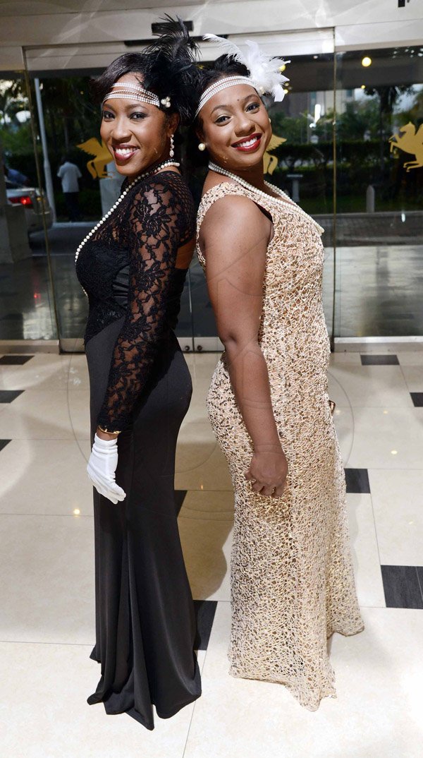 Rudolph Brown/Photographer

Alicia Petgrave (left) and Shaneille Bramwell flirt with the camera in their beautiful gowns.