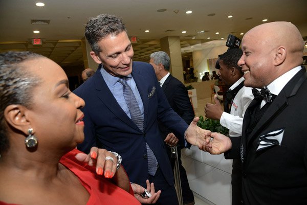Rudolph Brown/Photographer
Business Desk
Mark Chisholm, (right) Executive VP, Individual Line of Sagicor chat with Peter Melhado, CEO of ICD Group and Jacqueline Coke Lloyd at the Sagicor Corporate Awards Jamaica Pegasus Hotel
on Wednesday, March 23, 2016