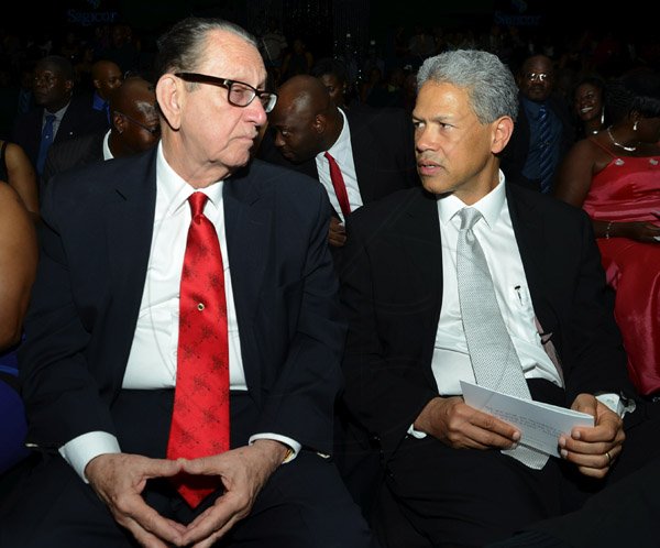 Rudolph Brown/Photographer
R. Danny Williams, (left) Chairman of Sagicor chat with Donovan Perkins centre, President and CEO Sagicor Investments JamaicaSagicor Jamaica Group 42 Annual Corporate Awards at the Jamaica Pegasus Hotel on Wednesday, March 20, 2013