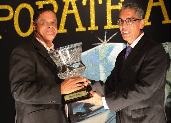Rudolph Brown/Photographer
Richards Blyes, (right) President and CEO of Sagicor presents the Chairman Trophy to Albert Lyon at Sagicor Jamaica Group 42 Annual Corporate Awards at the Jamaica Pegasus Hotel on Wednesday, March 20, 2013