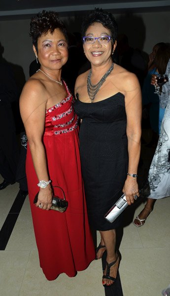 Rudolph Brown/Photographer
Lynette Chin-McDaniel, (left) pose with Arlene Lawrence Sagicor Jamaica Group 42 Annual Corporate Awards at the Jamaica Pegasus Hotel on Wednesday, March 20, 2013