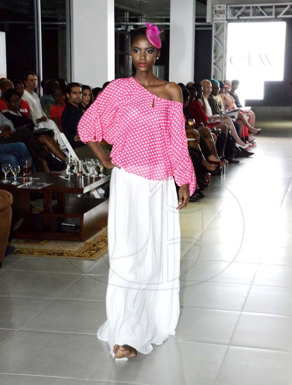 Winston Sill/Freelance Photographer
Saint International Jamaica Limited presents Styleweek Showspace, "Glitz Glam 'N Style", held at Silver Star Motors, South Camp Road on Thursday night May 22, 2014. This pastel pink and white polka dot top brought spring to this long white skirt from Elan by Heather Laine