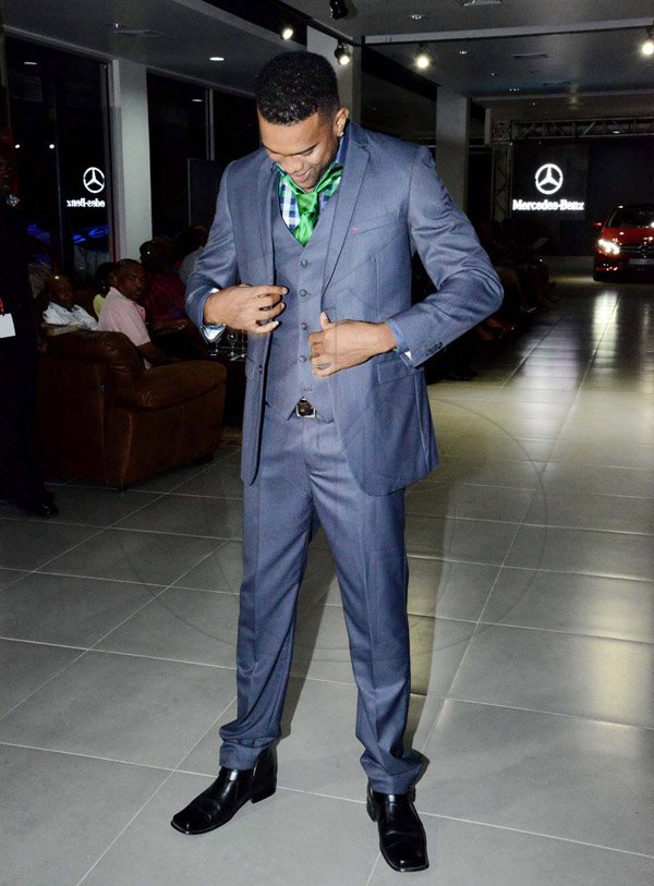 Winston Sill/Freelance Photographer
Saint International Jamaica Limited presents Styleweek Showspace, "Glitz Glam 'N Style", held at Silver Star Motors, South Camp Road on Thursday night May 22, 2014. MaxBrown Boutique pulled out all the stops accentuating this dark and suave gray tux with colourful undertones