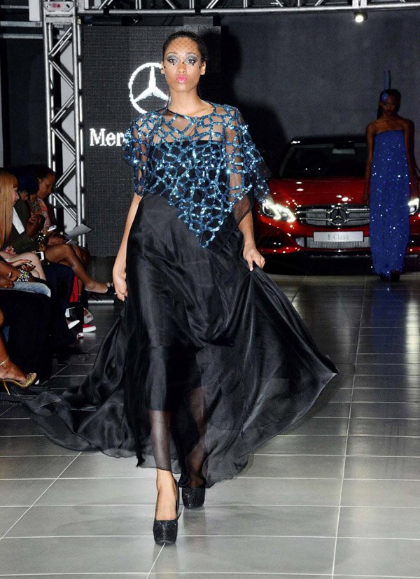Winston Sill/Freelance Photographer
Saint International Jamaica Limited presents Styleweek Showspace, "Glitz Glam 'N Style", held at Silver Star Motors, South Camp Road on Thursday night May 22, 2014. This sheer black dress was given a touch of glamour with this metallic blue from Tasha Gordon of TNT Fashion