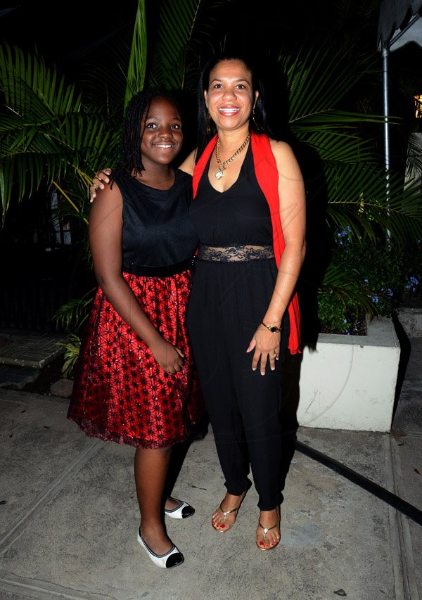 Winston Sill/Freelance Photographer
PUBLIC AFFAIRS DESK:------ Distinguished St Andrew 'old girl' Dr Lanie Oakley-Williams takes a pic with her daughter Kerese at the St Andrew Old Girls Association (SAOGA)  annual Valentine Dinner and Dance, held at Terra Nova All-Suite Hotel, Waterloo Road on Saturday night February 7, 2015.
