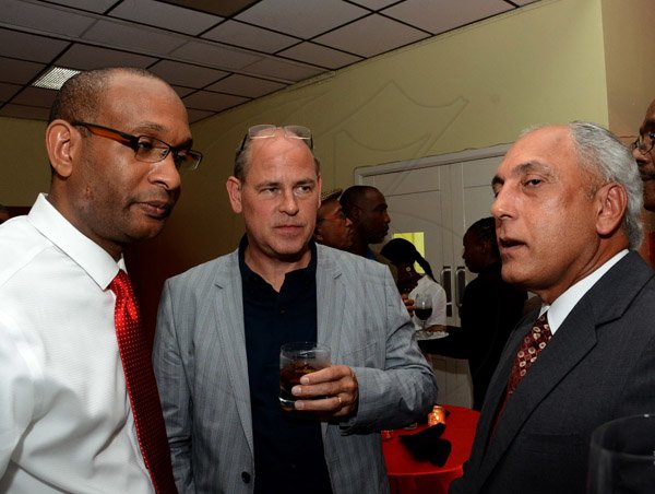 Winston Sill/Freelance Photographer
Scotiabank's President and CEO Jacqueline Sharp host Scotiabank 125th Anniversary Cocktails and Concert, held at Courtleigh Auditorium, St. Lucia Avenue, New Kingston on Thursday night September 4, 2014. Here are Lissant Mitchell (left); Marcel Schroder (centre); and Peter Moses (right).