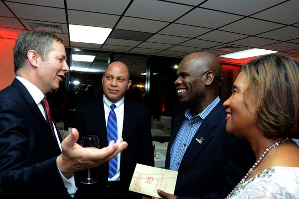 Winston Sill/Freelance Photographer
Scotiabank's President and CEO Jacqueline Sharp host Scotiabank 125th Anniversary Cocktails and Concert, held at Courtleigh Auditorium, St. Lucia Avenue, New Kingston on Thursday night September 4, 2014. Here are Bruce Bowen (left); Jeffery Hall (second left); Custos Steadman Fuller (second right); and Sonia Fuller (right).