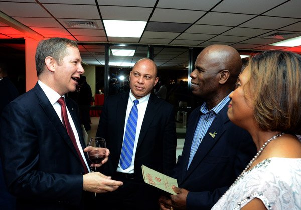 Winston Sill/Freelance Photographer
Scotiabank's President and CEO Jacqueline Sharp host Scotiabank 125th Anniversary Cocktails and Concert, held at Courtleigh Auditorium, St. Lucia Avenue, New Kingston on Thursday night September 4, 2014. Here are Bruce Bowen (left); Jeffery Hall (second left); Custos Steadman Fuller (second right); and Sonia Fuller (right).