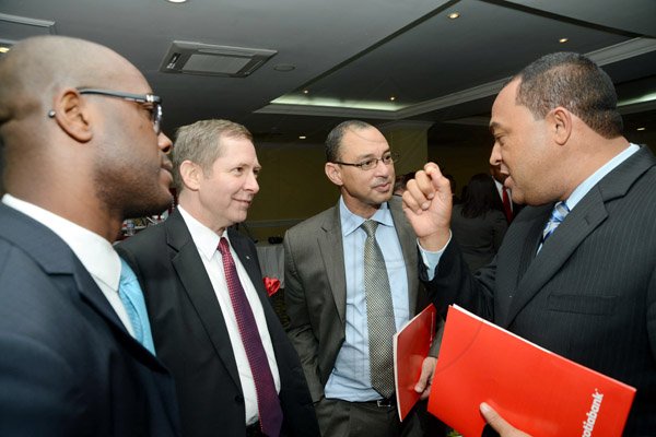 Rudolph Brown/Photographer
Don Wehby,(second right) CEO of GraceKennedy in discussion with from left Dr. Adrian Stokes, Bruce Bowen, President of CEO, Scotiabank and Christopher Tufton at the Scotiabank Cocktails and Conversations panel discussion at the Knutsford Court Hotel in New Kingston on Wednesday, May 15, 2013