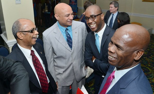 Rudolph Brown/Photographer
Steadman Fuller (right), Custos of Kingston chat with from left Wayne Powell, Scotiabank’s executive vice-president, Retail Banking, Roger Grant, senior manager, Scotiabank Private Banking and Dr. Adrian Stokes, Group Strategist at the Scotiabank Cocktails and Conversations panel discussion at the Knutsford Court Hotel in New Kingston on Wednesday, May 15, 2013