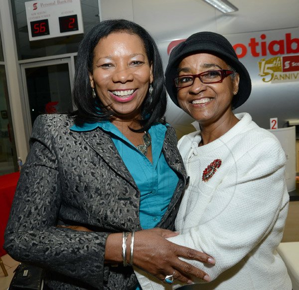 Rudolph Brown/Photographer
Lana Forbes,(left) senior manager at Scotia Jamaica Life Insurance and Kay Clunis at the Scotia Insurance 15th Anniversary branch forum at the Constant spring branch on Thursday, June 27, 2013