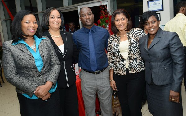 Rudolph Brown/Photographer
Denton Campbell pose with from left Lana Forbes, Ruth Campbell, Lorna Gordon- Elliott and Racquel Rowe at the Scotia Insurance 15th Anniversary branch forum at the Constant spring branch on Thursday, June 27, 2013
