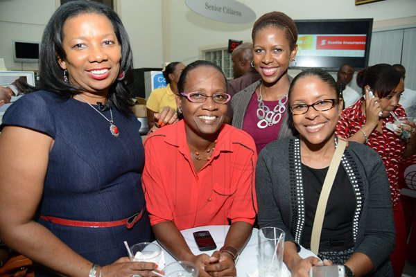 Rudolph Brown/Photographer
Lana Forbes,(left) senior manager at Scotia Jamaica Life Insurance pose with from right Marsha Williams, Shereen Duncan and Andrea Foster at the Ocho Rios branch Scotia Insurance 15th Anniversary cocktail forum on Tuesday, September 24, 2013