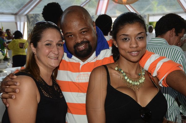 Rudolph Brown/Photographer
Solomon Sharpe pose with Stephanie Pearson, (left) and Anica Ventura at the Scotia Private Client Group Jamaica Open Polo tournament at Caymanas Estate on Sunday, April 29-2012