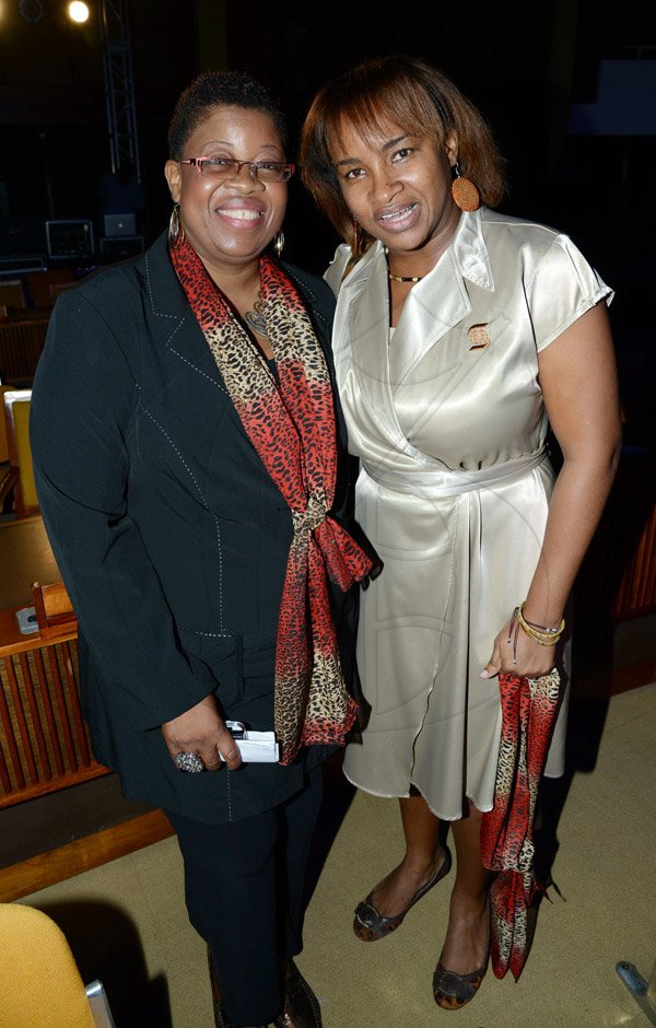 Rudolph Brown/Photographer
Debbie Clue, (left) and Klao Bell-Lewis at the Scotiabank Sales Conference 2014 awards "We Dominated We Conquered Now hear us ROAR" at the Jamaica Conference Centre on Saturday January 25,2014