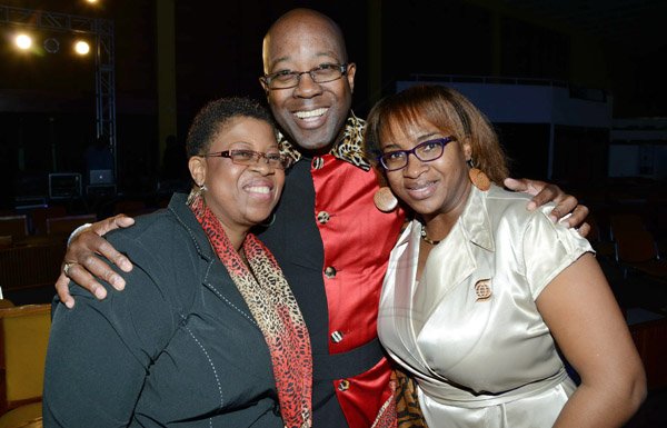 Rudolph Brown/Photographer
Hugh Reid, President of Scotia Life Insurance pose with Debbie Clue, (left) and Klao Bell-Lewis at the Scotiabank Sales Conference 2014 awards "We Dominated We Conquered Now hear us ROAR" at the Jamaica Conference Centre on Saturday January 25,2014