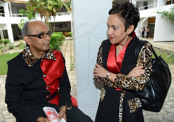 Rudolph Brown/Photographer
Jacqueline Sharp, President and CEO Scotiabank Group chat with Wayne Powell, Executive Vice President Retail Banking at the Scotiabank Sales Conference 2014 awards "We Dominated We Conquered Now hear us ROAR" at the Jamaica Conference Centre on Saturday January 25,2014