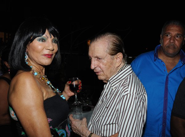 Winston Sill/Freelance Photographer
The Most Hon. Edward Seaga share Birthday Party with son Christopher Seaga and Minister Dr. Omar Davies, held at Russell Heights on Tuesday night May 28, 2013.   Here are Michelle Bovell (left); Seaga (centre); and Salemm Lazarus (right).