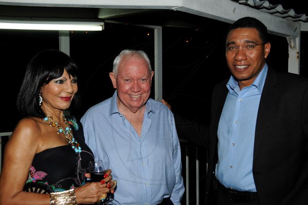 Winston Sill/Freelance Photographer
The Most Hon. Edward Seaga share Birthday Party with son Christopher Seaga and Minister Dr. Omar Davies, held at Russell Heights on Tuesday night May 28, 2013.  Here are Michelle Bovell (left); Chris Bovell (centre); and Andrew Holness (right).