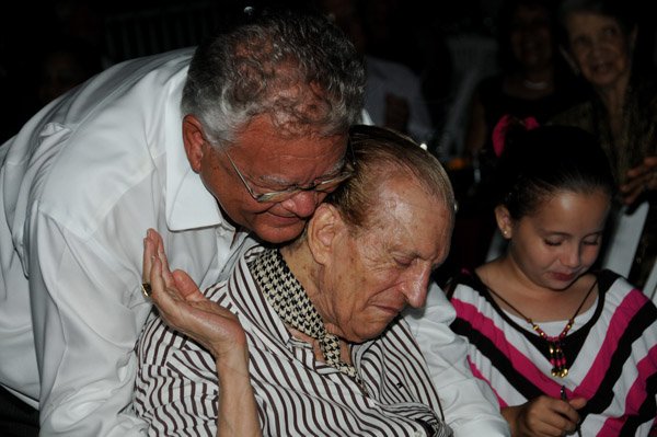 Winston Sill/Freelance Photographer
The Most Hon. Edward Seaga share Birthday Party with son Christopher Seaga and Minister Dr. Omar Davies, held at Russell Heights on Tuesday night May 28, 2013.   Here are Karl Samuda (left); Seaga (centre); and Gabrielle Seaga (right).