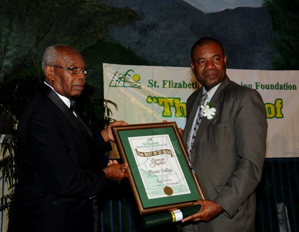 Winston Sill / Freelance Photographer
The St. Elizabeth Homecoming Foundation Limited (SEHF) 20th Annual Golden Awards Banquet, held at the Jamiaca Pegasus Hotel, New Kingston on Wednesday night November 28, 2012. Here are Crafton Miller (left); presenting to Albert Corcho (right), Principal of Munro College, for Education.