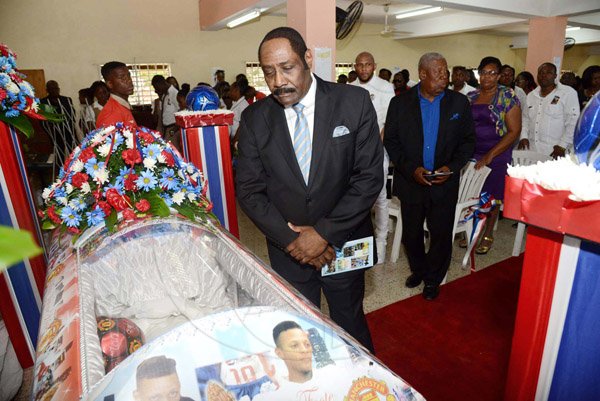 Rudolph Brown/Photographer
Capt, Horace Burrell, President of the Jamaica Football Federation looks at Jordan at the Thanksgiving service for Holy Trinity football player Jordan Foote at the Arnold Road Seventh-day Adventist Church on Sunday, March 27, 2016