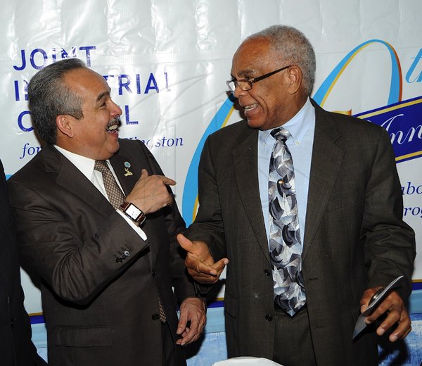 Ian Allen/Photographer
Dr Omar Davies (right) jokes with Carlos Urriola Tam, president of the Caribbean Shipping Association. They were attending the 60th Anniversary Luncheon and Awards Ceremony for the Joint Industrial Council for the Port of Kingston which was held at the Terra Nova Hotel in Kingston on Wednesday.