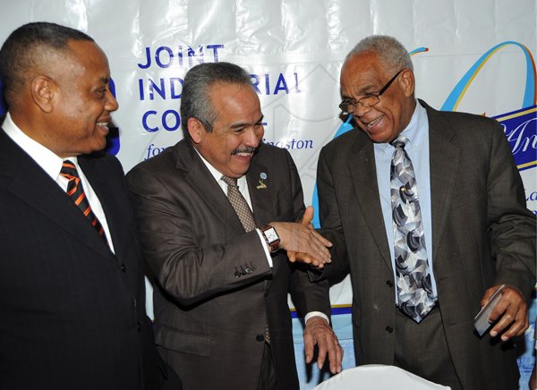 Ian Allen/Photographer
Transport Minister Dr Omar Davies (right) greets Carlos Urriola Tam (centre), president of the Caribbean Shipping Association, while Labour Minister Derrick Kellier looks on. They were attending the 60th Anniversary Luncheon and Awards for the Joint Industrial Council for the Port of Kingston which was held at the Terra Nova Hotel in Kingston on wednesday.