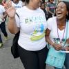 Rudolph Brown/Photographer
Audrey Flowers-Clarke, (left) shares a joke that has  Alysia Moulton White in stitches during the Sagicor Sigma Corporate Run.