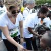 Rudolph Brown/Photographer
Tessanne Chin and Lady Allen greets  competitors in the wheelchair at the Sagicor Sigma Corporate Run at Emancipation Park in New Kingston on  Sunday, February 16, 2014