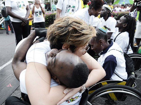 Rudolph Brown/Photographer
Tessanne Chin and Lady Allen greets  competitors in the wheelchair at the Sagicor Sigma Corporate Run at Emancipation Park in New Kingston on  Sunday, February 16, 2014