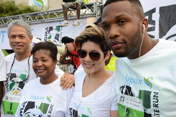 Rudolph Brown/Photographer
Lady Allen, (second left) pose with from left Donavon Perkins, Tessanne Chin and Agent Sasco at the Sagicor Sigma Corporate Run at Emancipation Park in New Kingston on  Sunday, February 16, 2014