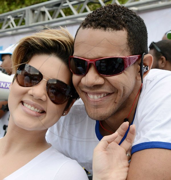 Rudolph Brown/Photographer
Tessanne Chin and her adoring husband Michael Anthony Cuffe Jr.were having a moment when our lens caught them canoodled in each others arms at the Sagicor Sigma Corporate Run.