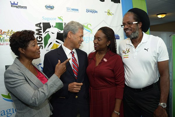 Ian Allen/Photographer
Lady Patricia Allen left, Patron of the 2013 Sagicor Sigma Corporate Run talks with Donovan Perkins second left, President and CEO Sagicor Investments Jamaica Limited, Shelly-Ann Harris second right, Senior Communications Manager Digicel and Steven"Frano" Francis during the Official Launch of the Sagicor Sigma Corporate Run 2013 at the Jamaica Pegasus Hotel in Kingston on Wednesday.