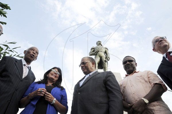 Norman Grindley/Chief Photographer
Venezuela Ambassador to Jamaica Maria Jacqueline Mendoza Ortega, (second left) flank by government ministers AJ Nicholson, (left) minister of Foreign Affairs Peter Phillips minister of Finance and planning (centre) Ronald Thwaites, (right) minister of Education and Phillip Paulwell, minister of mining. The occasion was a wreath laying ceremony at the statue of Simon Bolivar at the National cercle in Kingston yesterday.