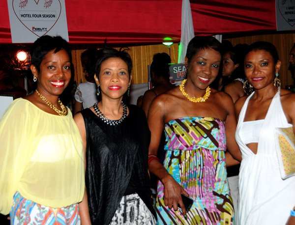 Winston Sill/Freelance Photographer
The Heart Foundation of Jamaica (HFJ) annual Simply Red Wine and Food Fundraising event, held on The Lawns of Jamaica House, Hope Road on Friday night September 27, 2013. Here are Paula McKay (left); Sheryl Tomlinson (second left); Debra Taylor (second right); and Jackie Domenico (right).