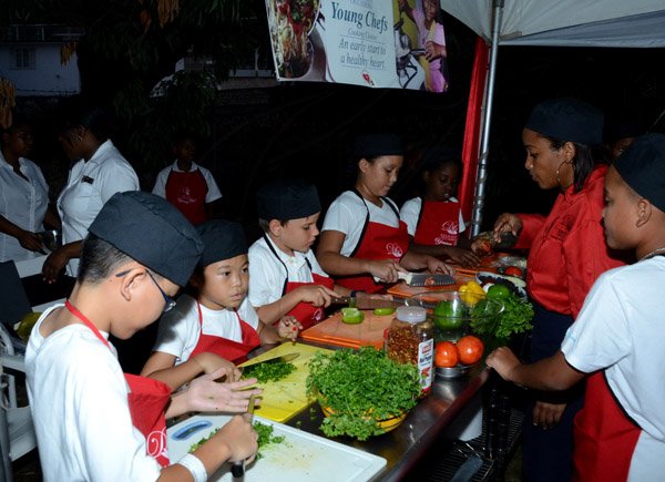 Winston Sill/Freelance Photographer
The Heart Foundation of Jamaica prersents the Media Launch of Simply Red, Wine and Food Festival, held at Millsborough Close on Tuesday night August 19, 2014. Here are young chefs at work.