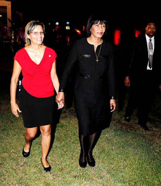 Winston Sill / Freelance Photographer
Heart Foundation of Jamaica  (HFJ) annual Wine and Food Festival, dubbed "Simply red and Wine Festival, held at Jamaica House Lawns on Friday night September 28, 2012. Here are Deborah Chen??(left); and Prime Minister Portia Simpson-Miller (right).
