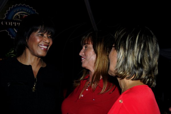 Winston Sill / Freelance Photographer
Heart Foundation of Jamaica  (HFJ) annual Wine and Food Festival, dubbed "Simply red and Wine Festival, held at Jamaica House Lawns on Friday night September 28, 2012. Here are Prime Minister Portia Simpson-Miller (left); Rosa Joseph (centre); and Deborah Chen??? (right).